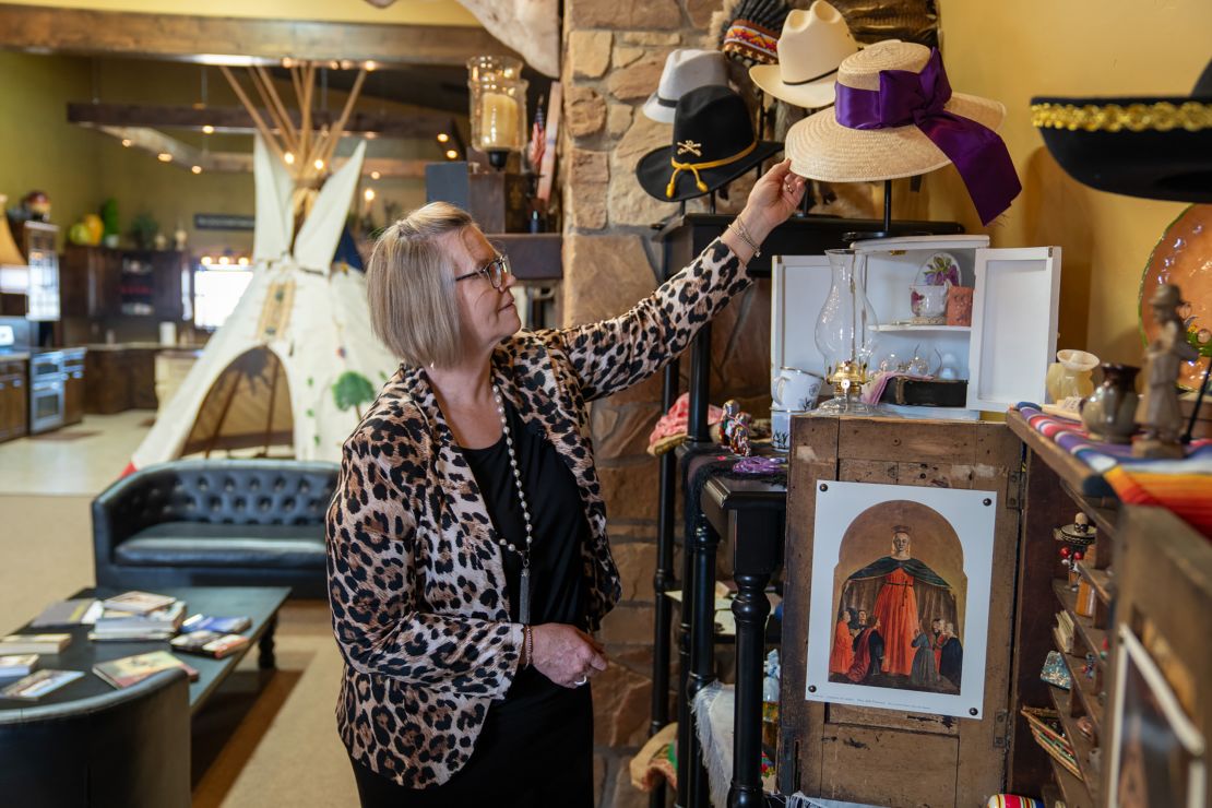 Tina Siemens, who runs the West Texas Living Heritage Museum, showcases traditional Mennonite hats.