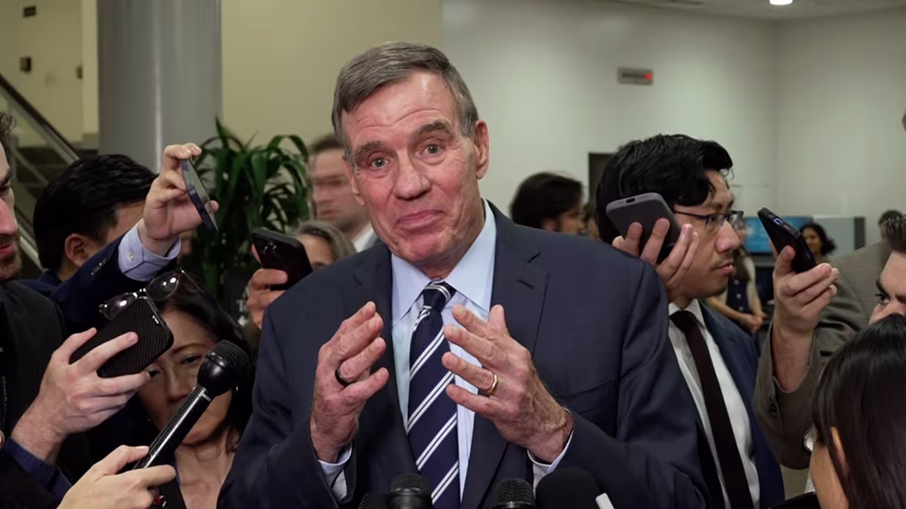 Sen. Mark Warner speaks to members of the media on Thursday.