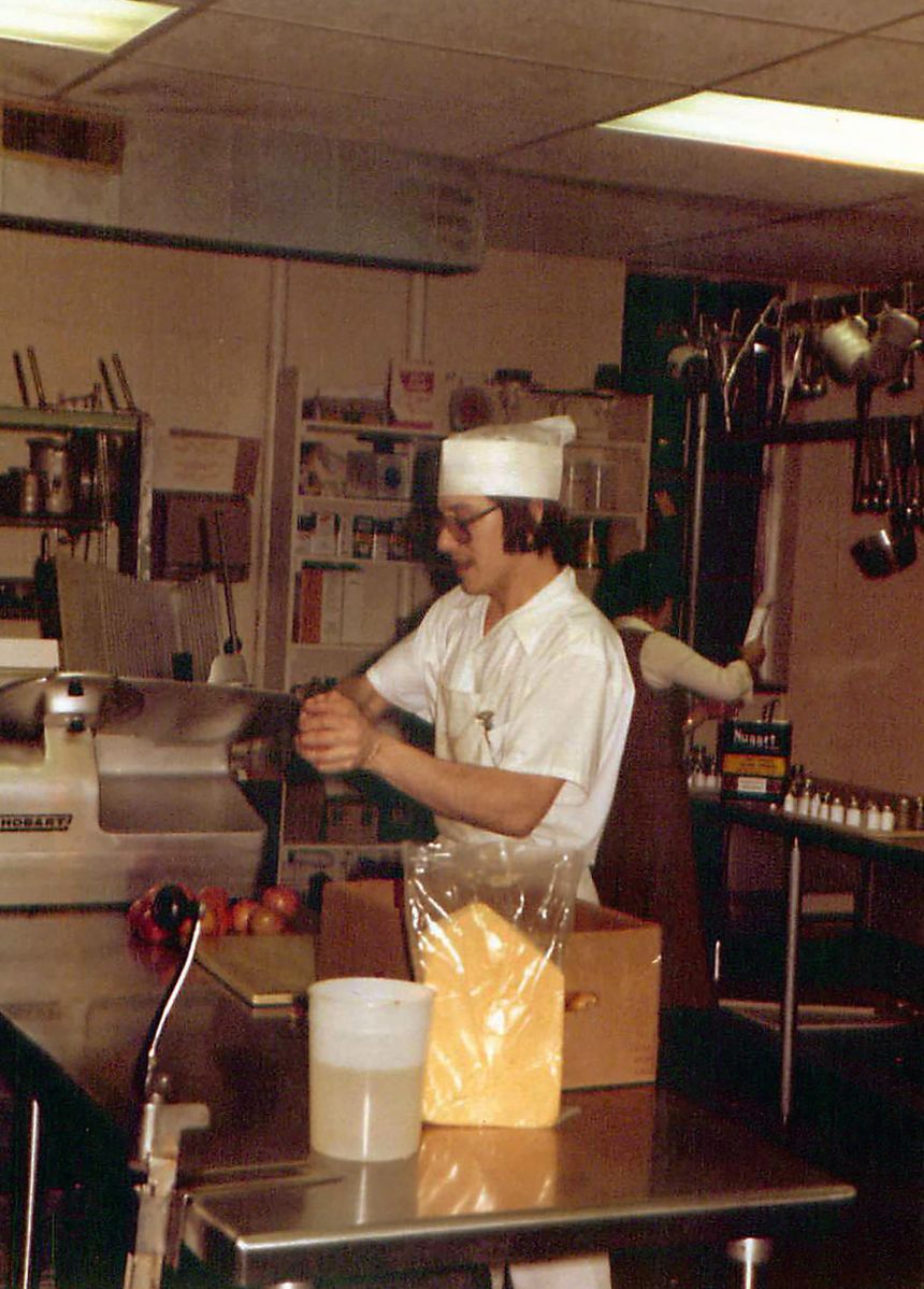 In November 1980, John worked on the catering team at MidAmerica Nazarene University in Kansas. Here he is working in the kitchen