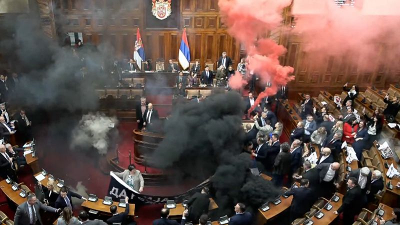 Video shows protesters tossing smoke granades, tear gas in Serbia’s parliament