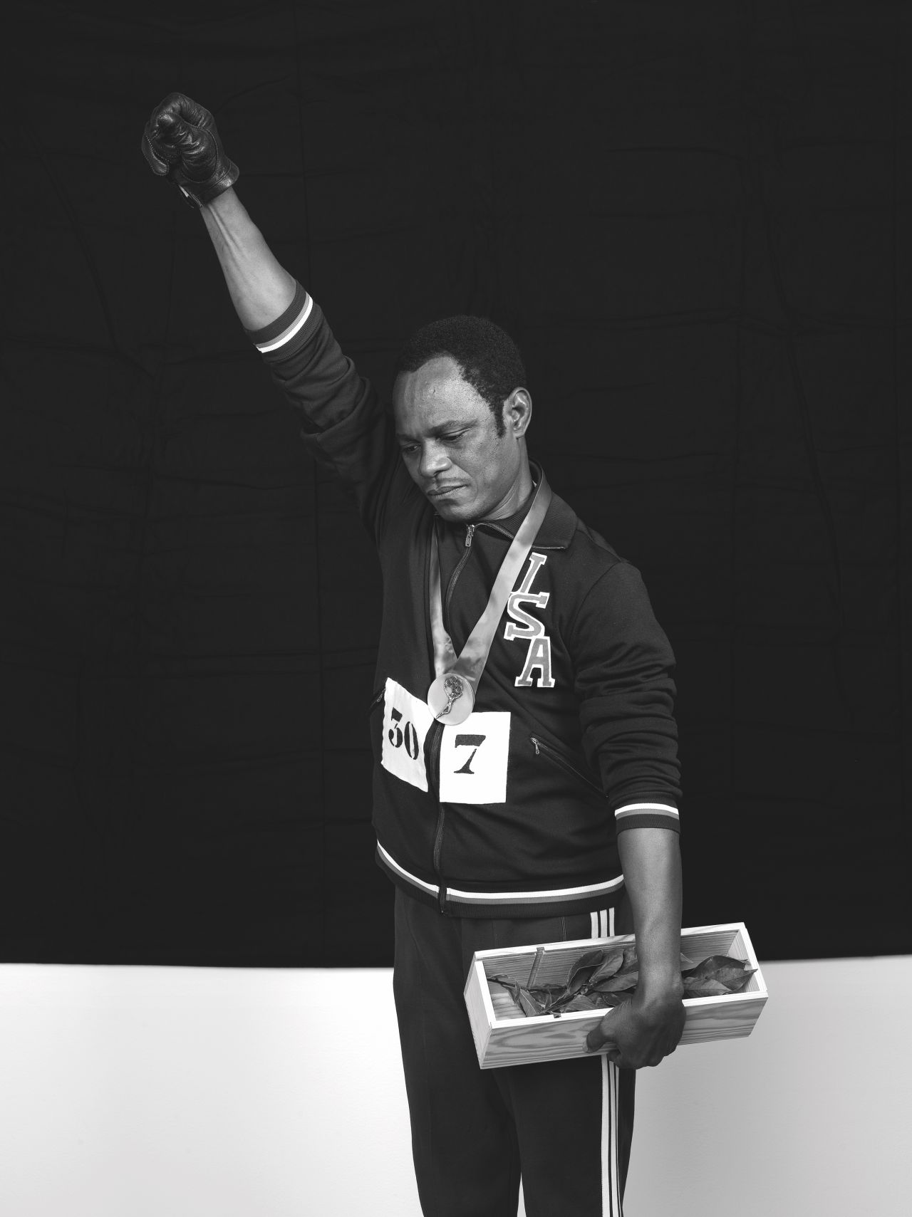 Samuel Fosso strikes the iconic pose of Olympian Tommie Smith in this photograph from the 2008 series