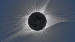 The solar corona glows in visible white light during the total solar eclipse over Mitchell, Oregon on August 21, 2017 from an image taken during an experiment.