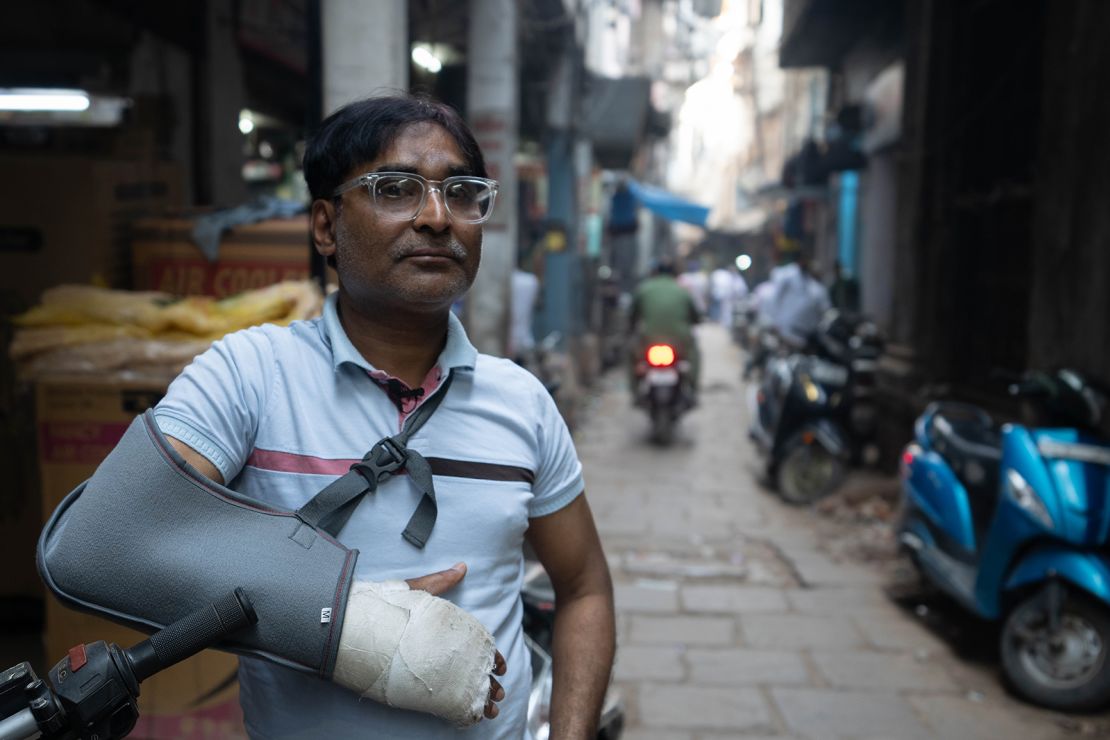Shamsher Ali worries for his young daughters, who he says are growing up in an increasingly polarized India. His arm was in a cast from a recent traffic accident.