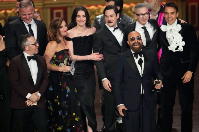 Adam Greenfield, left, David Adjmi, center, and cast and crew members from "Stereophonic" accept the award for best play.