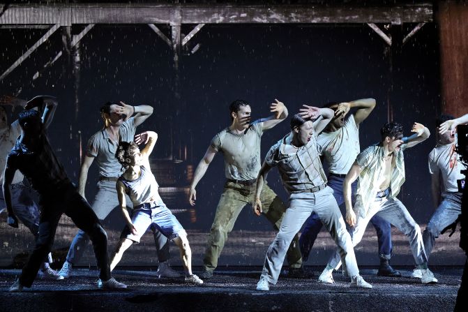 The cast of "The Outsiders" performs onstage.