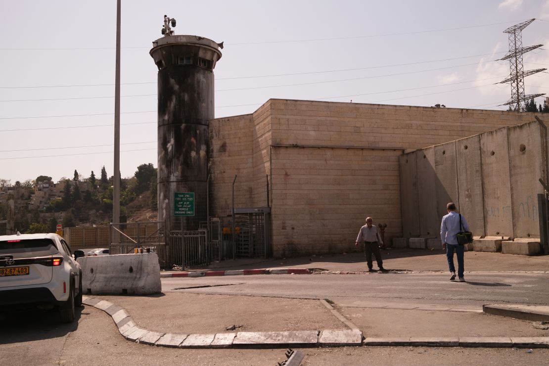 The notoriously overcrowded Shuafat Refugee Camp is cut off from the rest of East Jerusalem. Pictured here is the checkpoint at the camp's exit, flanked by a police watchtower.