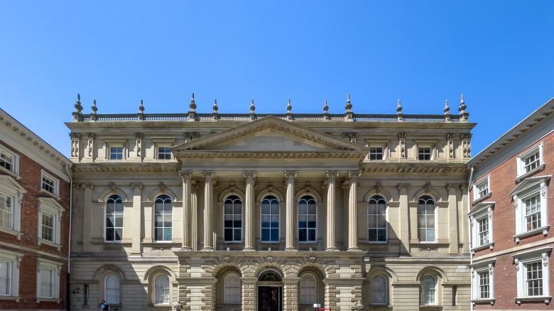  Osgoode Hall with a late Palladian architectural style. The landmark is placed in the downtown district by the Nathan Phillips square in Toronto on May 13, 2021