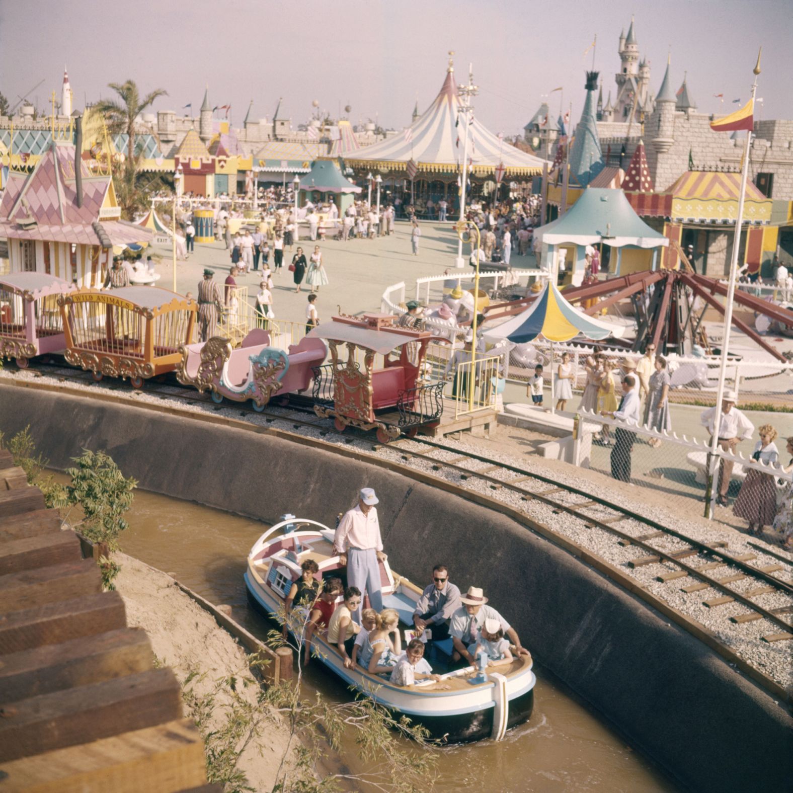 People ride a boat at the park.