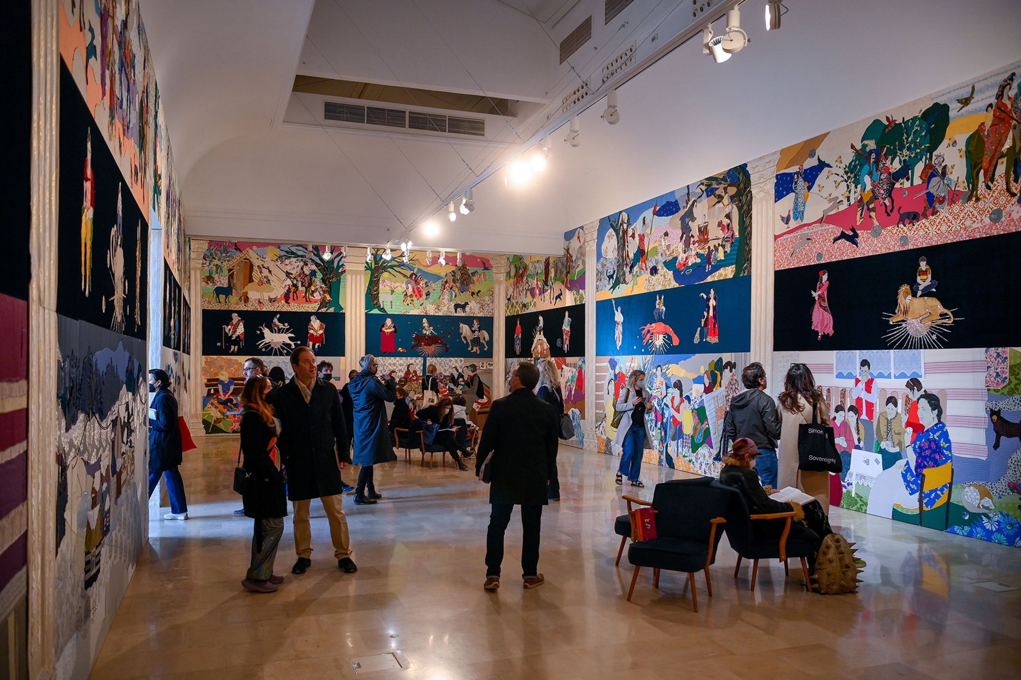 Visitors in the Polish pavilion at the 2022 Venice Biennale, which featured work by the Romani-Polish artist Malgorzata Mirga-Tas.