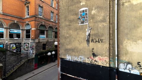 Mandatory Credit: Photo by Adrian Langtry/Shutterstock (14077957b)
'Well Hung Lover,' also called 'Naked Man Hanging From Window' and simply 'Naked Man,' is a mural by the anonymous street artist Banksy, on a wall on Frogmore Street. It has been partially defaced since first appearing in 2006.
'Well Hung Lover' mural by Banksy, Bristol, England, UK - 15 Apr 2023