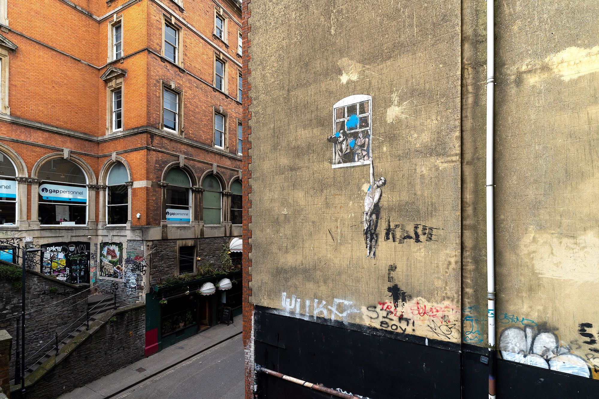 Banksy painted "Well Hung Lover" on a Bristol building back in 2006.