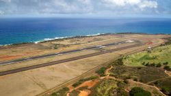 Aerial view over the airport of Lihue, Kauai, Hawaii, USA with view over the runway to the coastline. 31 Jul 2016