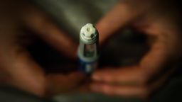 A woman holds an Ozempic needle shot pen in this photograph taken in Warsaw, Poland on 19 November, 2023.