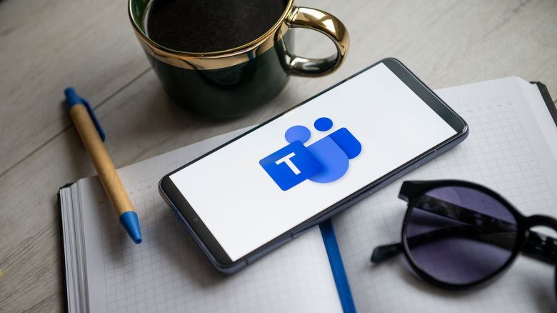 A Microsoft Teams logo is displayed on a smartphone in Poland.