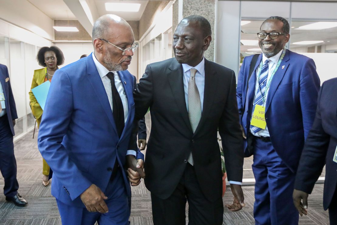 Former Prime Minister of Haiti Ariel Henry (left) with Kenyan President William Ruto (center) at the United Nations Environment Programme headquarters in Nairobi on February 29.