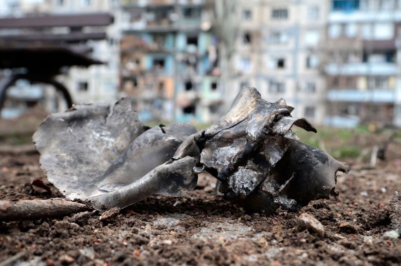 Rocket debris is scattered by a strike near a residential building in Zaporizhzhia.