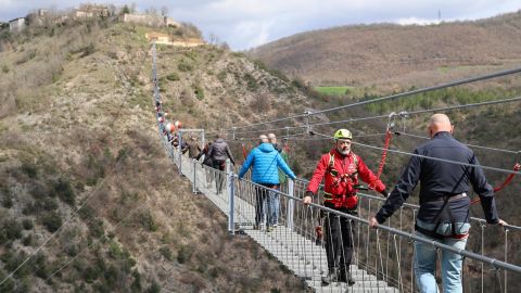 Mandatory Credit: Photo by Gianluigi Basilietti/EPA-EFE/Shutterstock (14399364k)
People walk on the suspended bridge in Sellano, in the heart of the Umbrian Valnerina, in Perugia, Italy, 23 March 2024. The highest Tibetan bridge in Europe was inaugurated with 175 meters dividing it from the valley floor. For a length of 517.5 meters and 1,023 steps, an estimated journey time of 30-45 minutes.
The highest Tibetan bridge in Europe inaugurated in Sellano, Italy, Sellano Perugia - 23 Mar 2024