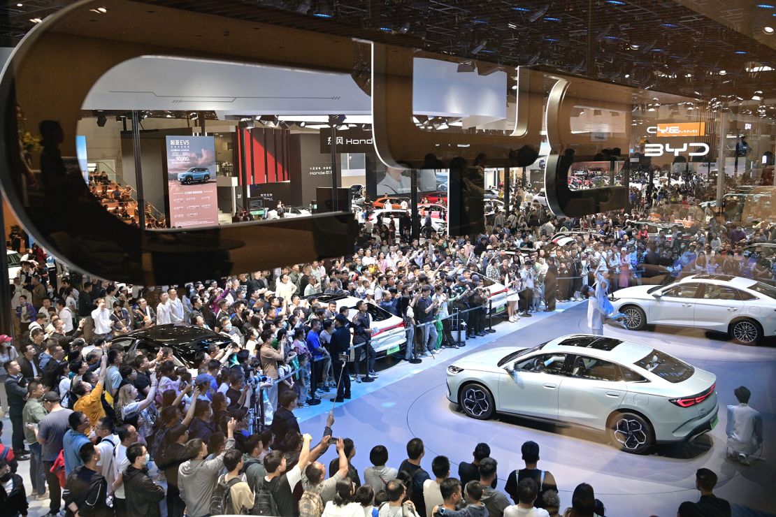 Visitors crowd around BYD vehicles at the 2024 Beijing International Automotive Exhibition in May 2024.