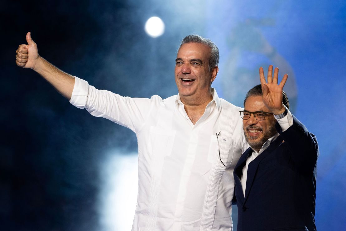 President and candidate for reelection Luis Abinader (L) and the official candidate for senator for the National District Guillermo Moreno attend a campaign event in Santo Domingo, Dominican Republic, 11 May 2024.