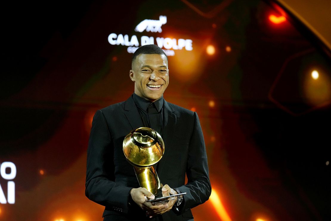 Mbappé accepts the Best Men's Player trophy at the Global Soccer Awards Europe Edition in Sardinia.