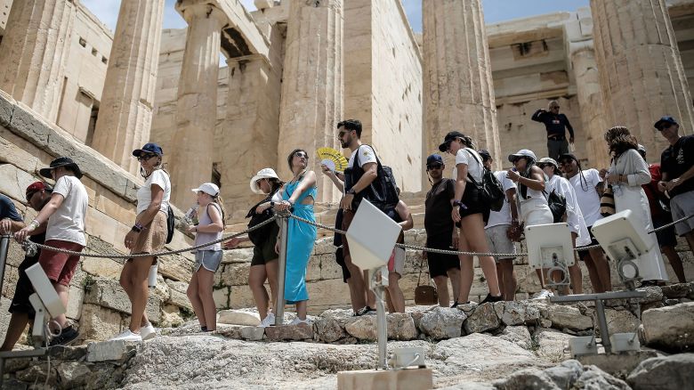 Mandatory Credit: Photo by KOSTAS TSIRONIS/EPA-EFE/Shutterstock (14534026j)
A visitor uses a handheld fan as tourists line up to exit the Acropolis during a heatwave, in Athens, Greece, 11 June 2024. The extended high pressure area over the coasts of Africa and central Mediterranean, which is accompanied by very warm air masses, is gradually extending eastward and will bring very high temperatures in Greece from 11 until 14 June. A circular of the Interior Ministry outlines how civil services will operate during the heatwave forecast in Greece by the National Meteorological Service.
Tourists visit the Acropolis amid heatwave in Greece, Athens - 11 Jun 2024