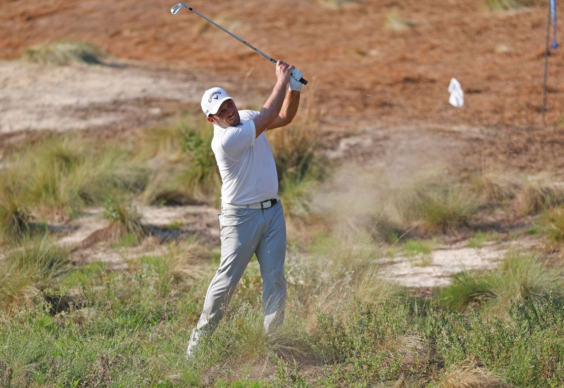 Francesco Molinari hits out of the rough to the eighth green during the second round.