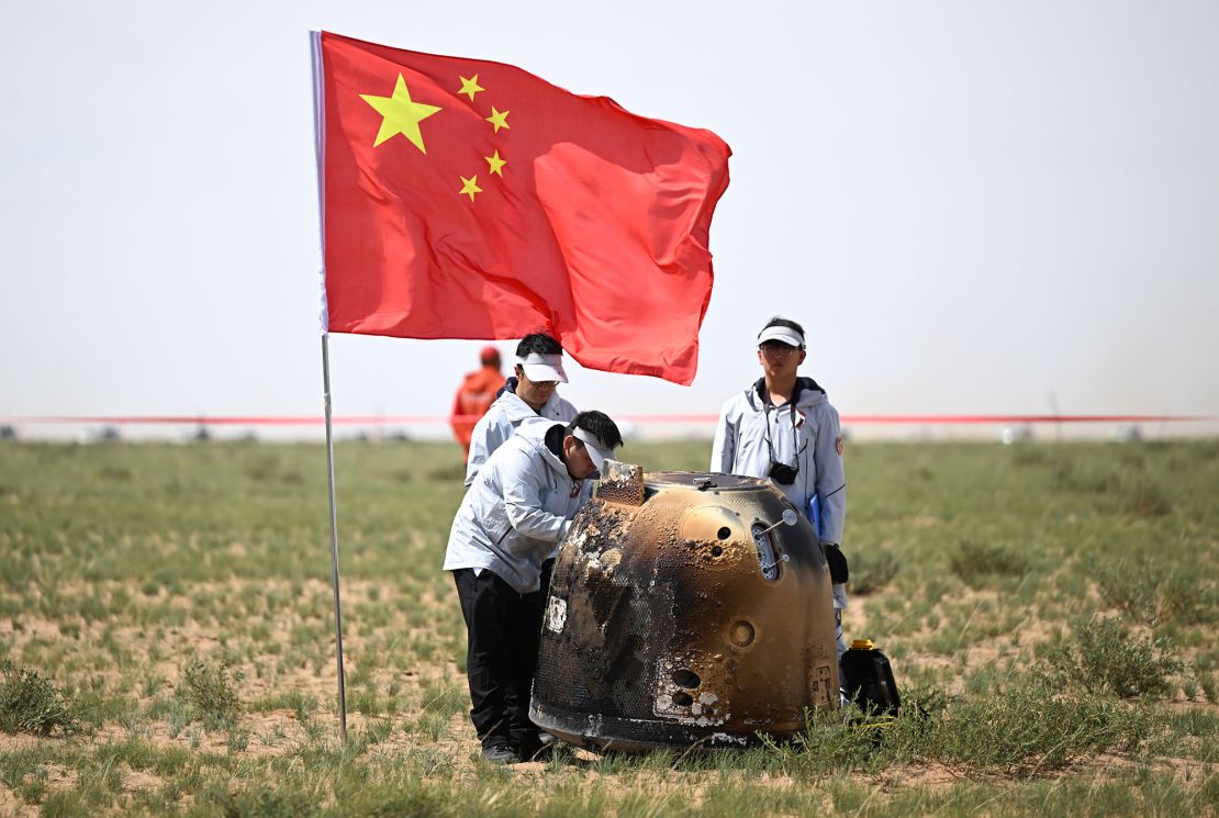 The Chang'e-6 probe's return capsule, which contained lunar samples from the moon's far side, is shown on June 25 after landing in China's Inner Mongolia Autonomous Region.