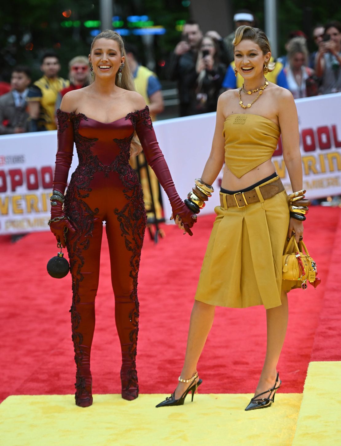 Gigi Hadid, on the red (and yellow) "Deadpool and Wolverine" carpet with friend Blake Lively, who wore a red lace catsuit by Versace. 