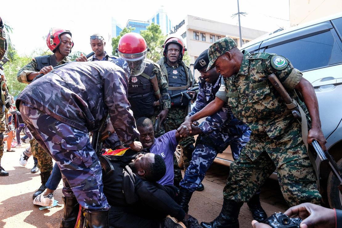 Military and police personnel arrest protesters during the anti-corruption protest in the Ugandan capital, Kampala, on July 23, 2024.