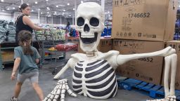 Customers walk past Halloween decorations for sale at a Costco store in Washington, DC, USA, 08 August 2024.