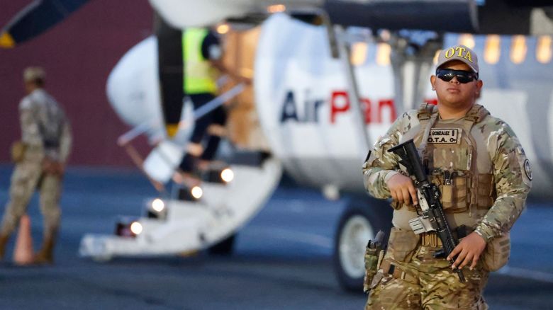 Mandatory Credit: Photo by BIENVENIDO VELASCO/EPA-EFE/Shutterstock (14650575b)
A member of the Tactical Aeronaval Operations (OTA) group monitors during a deportation process of migrants to Colombia at Albrook 'Marcos A. Gelabert' International Airport in Panama City, Panama, 20 August 2024. The Panamanian government deported the first group of 29 migrants who crossed the Darien illegally, as established by a memorandum of understanding between the governments of Panama and the US.
Panama deports 29 migrants who crossed the Darien to Colombia, Panama City - 17 Aug 2024