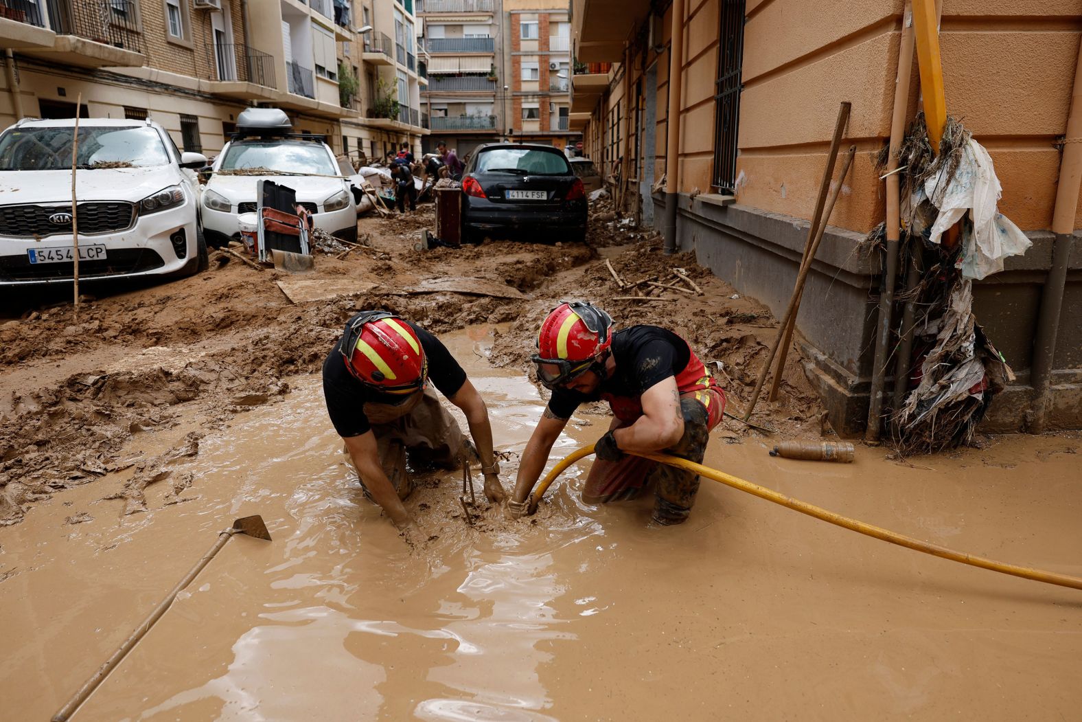 Emergency Military Unit members help clean up in Paiporta on Friday.