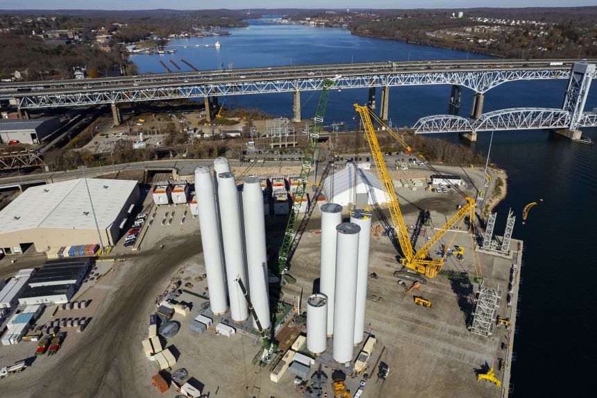 Crews assemble the tower of a wind turbine for the Revolution Wind offshore wind turbine farm on November 20, 2024. The project was halted by the Trump administration last week despite being 80% complete.