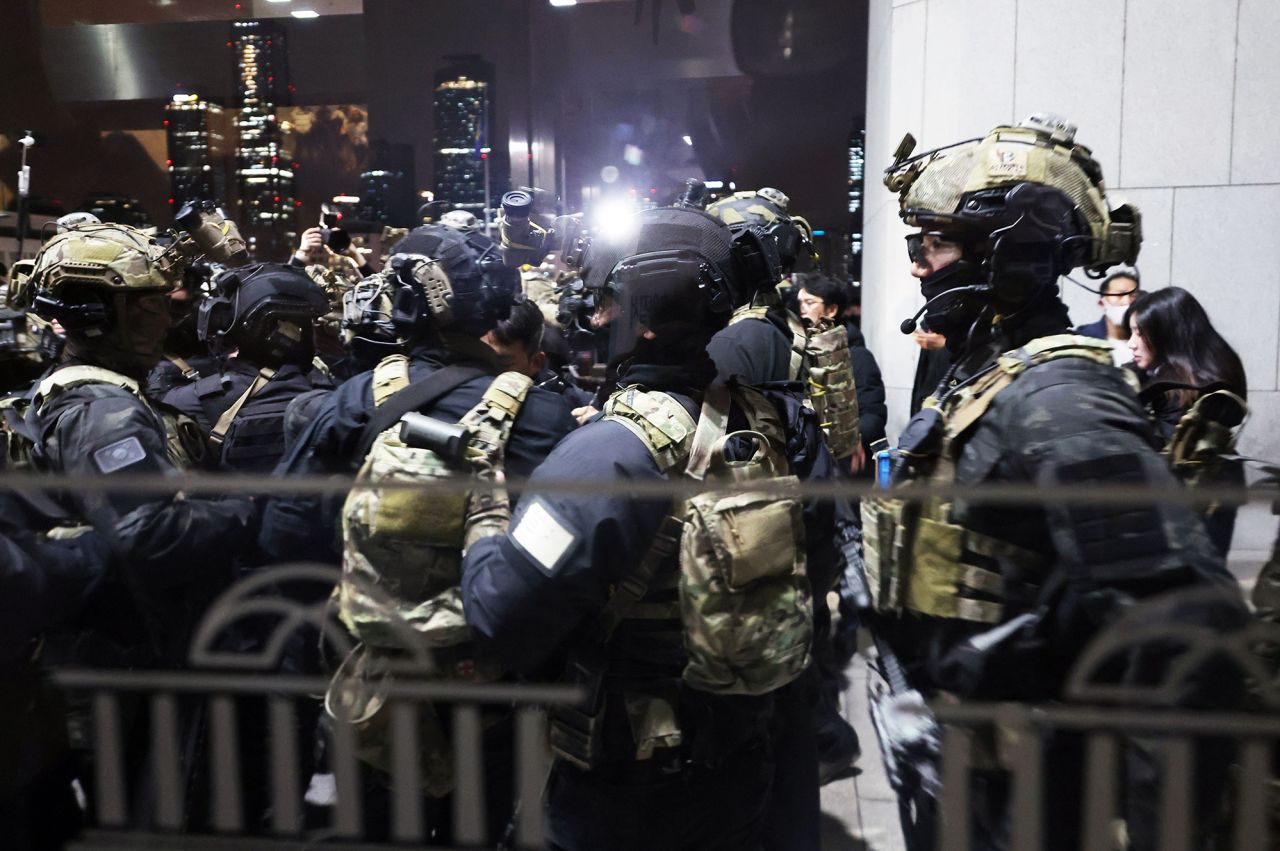 Soldiers prepare to enter the main hall of the National Assembly in Seoul following President Yoon Suk Yeol's declaration of martial law.