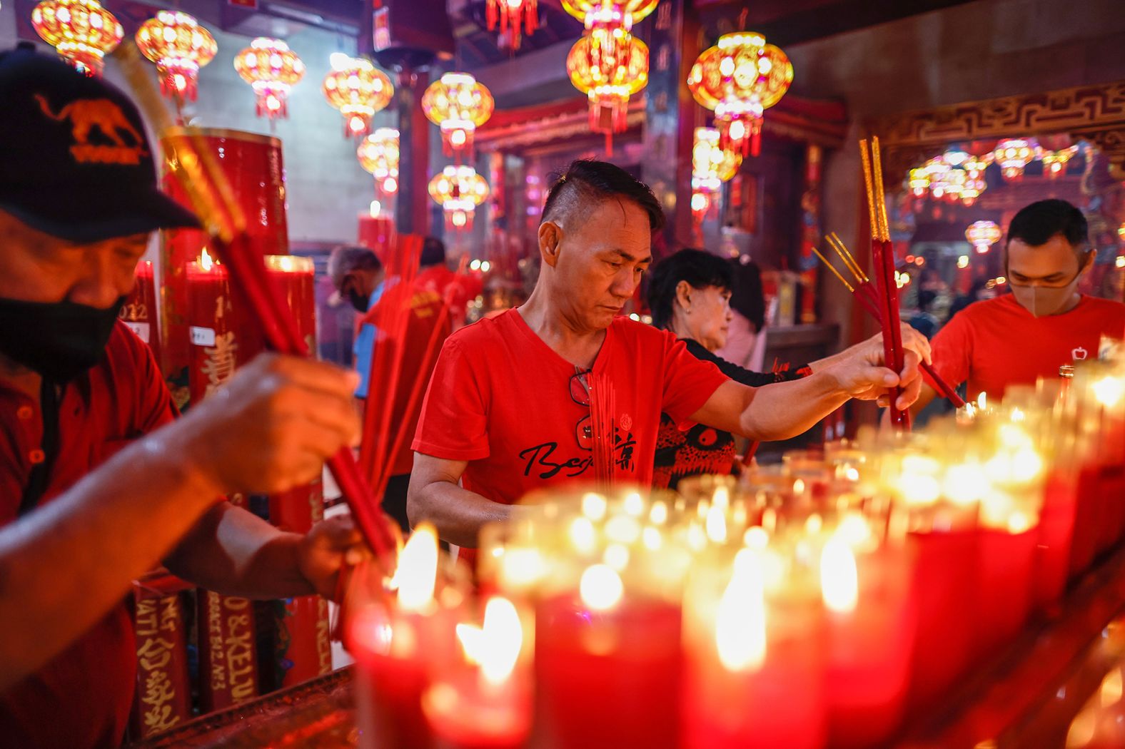People light incense sticks during Chinese Lunar New Year celebrations at Hok Lay Kiong temple in Bekasi, West Java, Indonesia, on Wednesday.