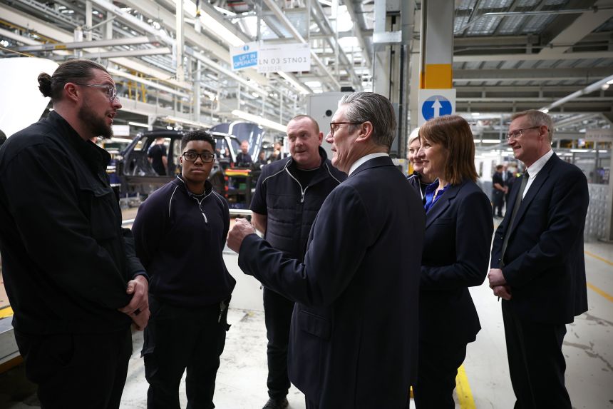 British Prime Minister Keir Starmer (C) and Chancellor of the Exchequer Rachel Reeves (C-R) talk to workers during their visit at the Jaguar Land Rover factory in Solihull, Britain, 07 April 2025.