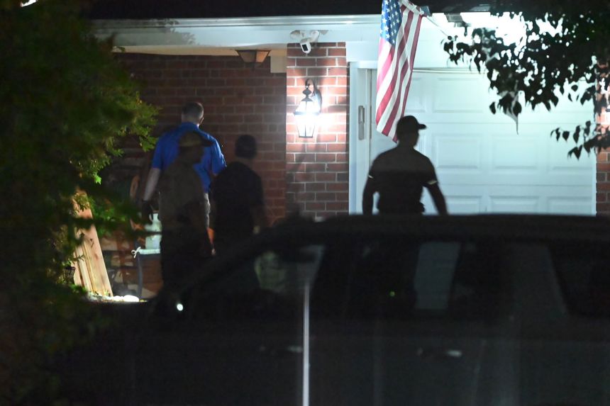 Authorities search the home of 31-year-old Kevin Krebs in Malvern, Pennsylvania, on Monday.