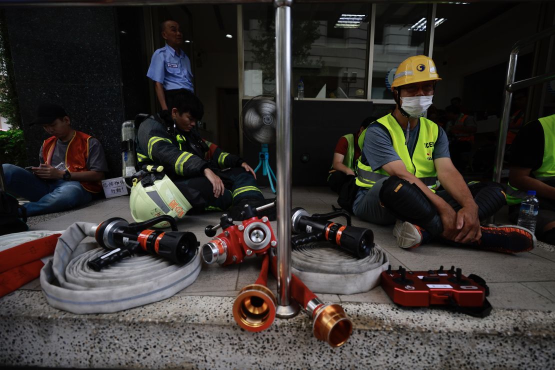 Rescuers and volunteers take shelter during an air raid drill as part of the annual Han Kuang military exercises, in Taipei, Taiwan, 17 July 2025.