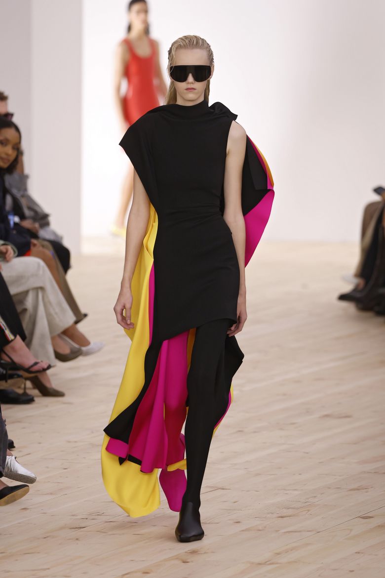 First worn on a model at Paris Fashion Week, the draped dress was selected for Obama by stylist Meredith Koop and its graphic color reflects the 