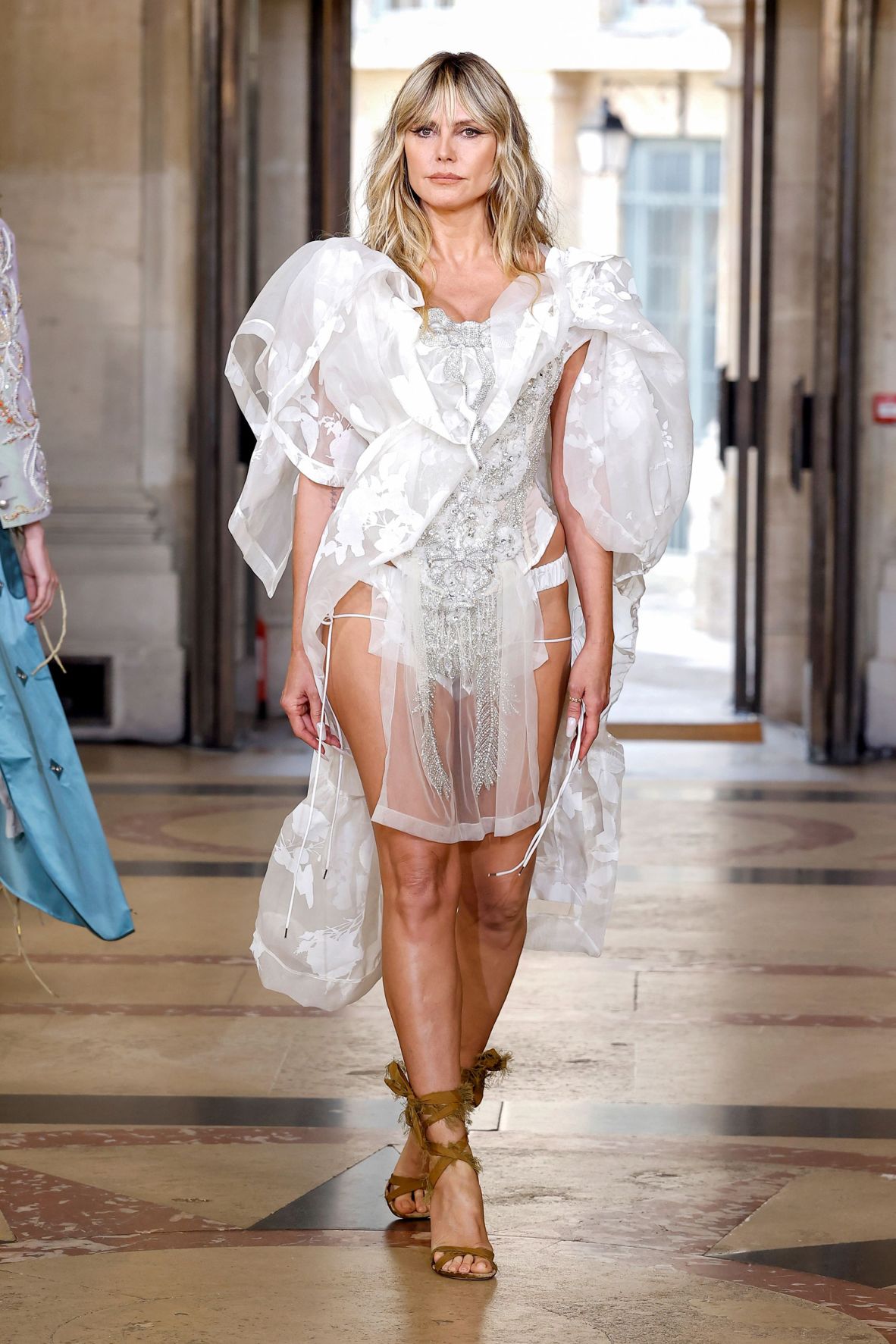 Model Heidi Klum closed the Vivienne Westwood show, designed by Andreas Kronthaler, at Paris Fashion Week.
