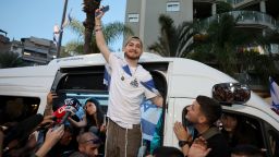 Released Israeli hostage Bar Kupershtein waves to supporters as he returns to his home in the city of Holon, Israel, after completing hospitalization and treatment following his release from captivity, on November 2.