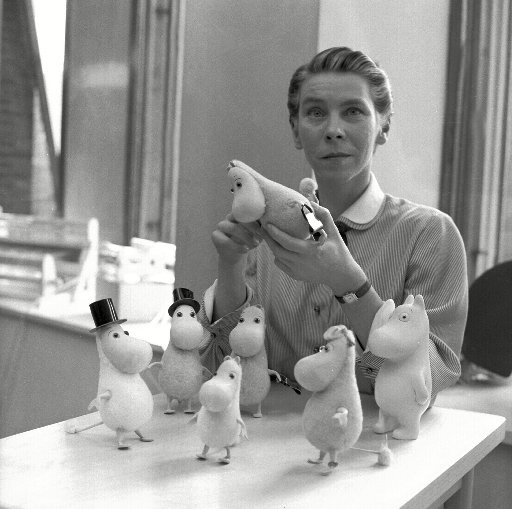 Artist Tove Jansson pictured in 1956 with the famous Moomin figures she created.