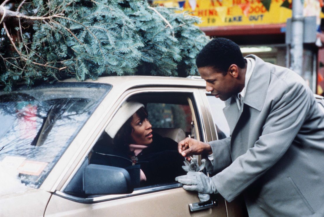 Whitney Houston and Denzel Washington in a scene from 