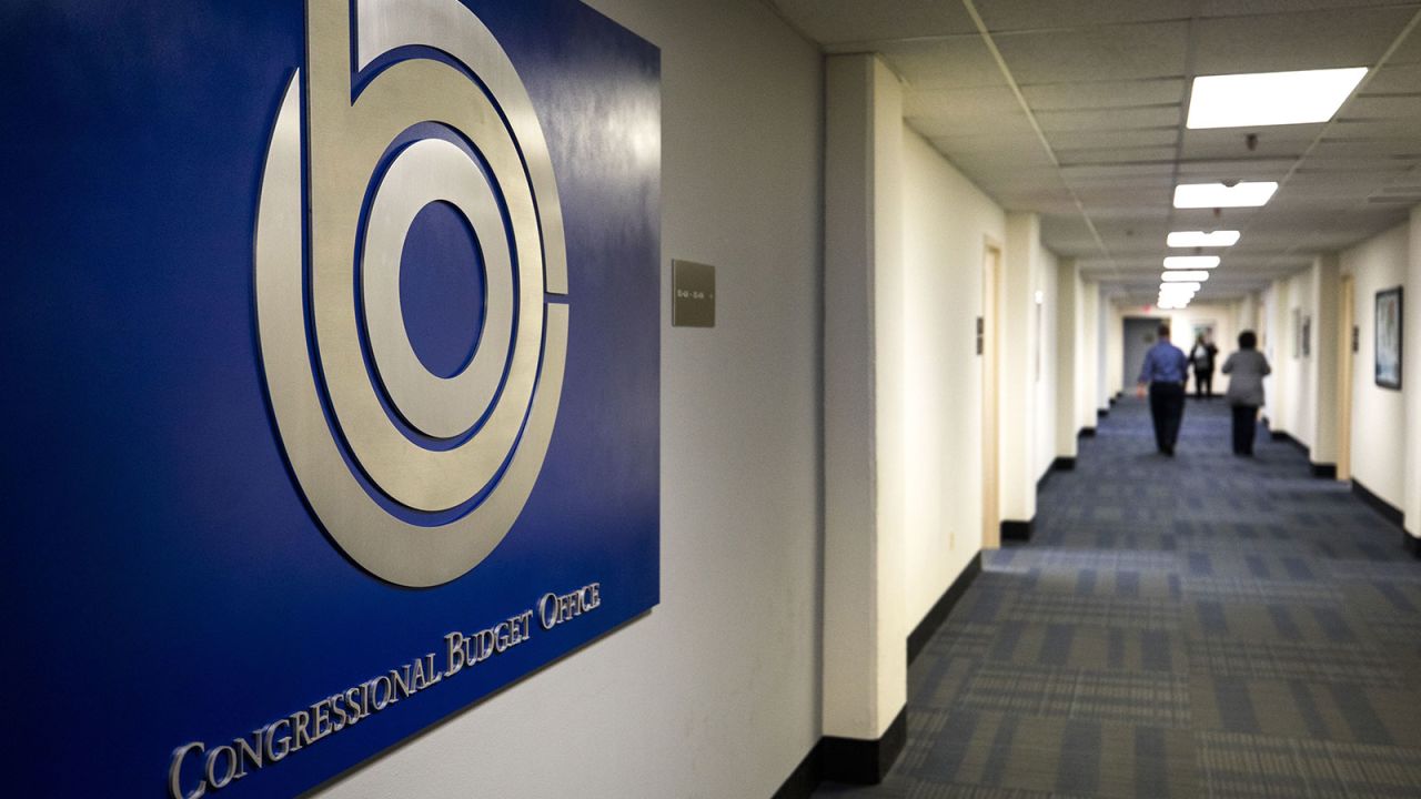A sign identifies the offices of the nonpartisan Congressional Budget Office (CBO) in the Ford House Office Building in Washington DC, on 13 March 2017.