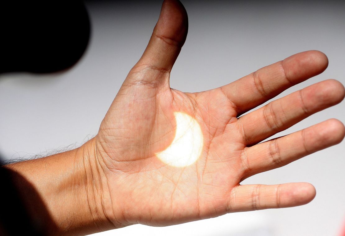 An image of the sun during a solar eclipse is projected onto a hand in Ensenada, Baja California, Mexico, August 21, 2017. The city was not in the eclipse's path of totality, thus the moon only partially blocked the sun.