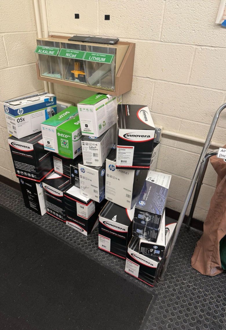 Stacks of office supplies are collected as a Goddard building is emptied.