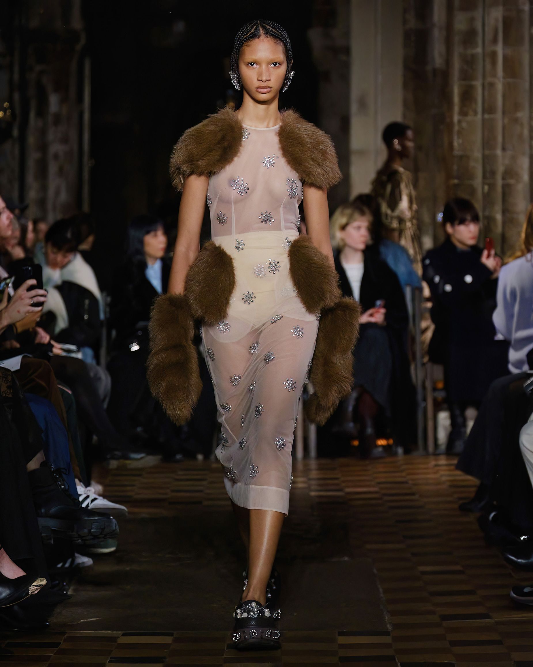 Faux fur was a major theme at the Simone Rocha show, where patches were used to alter the silhouette like hip or shoulder pads.