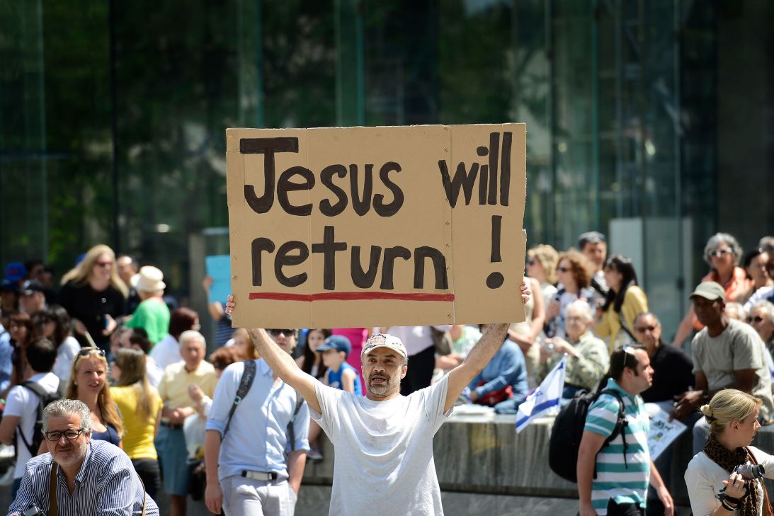A paradegoer holds a sign at the Israel Day Parade celebrating the nation's 64th birthday on June 3, 2012, in New York.