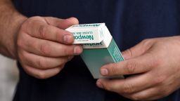 A man holds a pack of Newport menthol cigarettes in the Queens borough of New York City, NY, May 17, 2022. The FDA announced it intends to ban menthol cigarettes due to higher rates of smoking-related illness and death in African-Americans communities where they are heavily advertised, as well as flavored cigars popular with younger smokers; the menthol chemical added to cigarettes reduces throat irritation associated with smoking.  (Photo by Anthony Behar/Sipa USA)