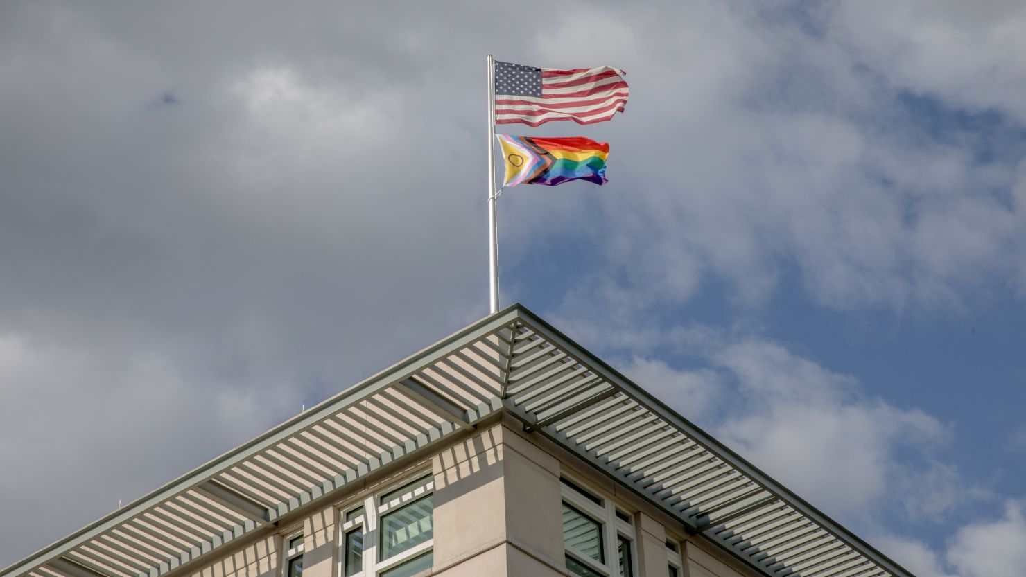 A symbol of unity and inclusiveness adorns the front of the US Embassy in Berlin on June 28, 2023.